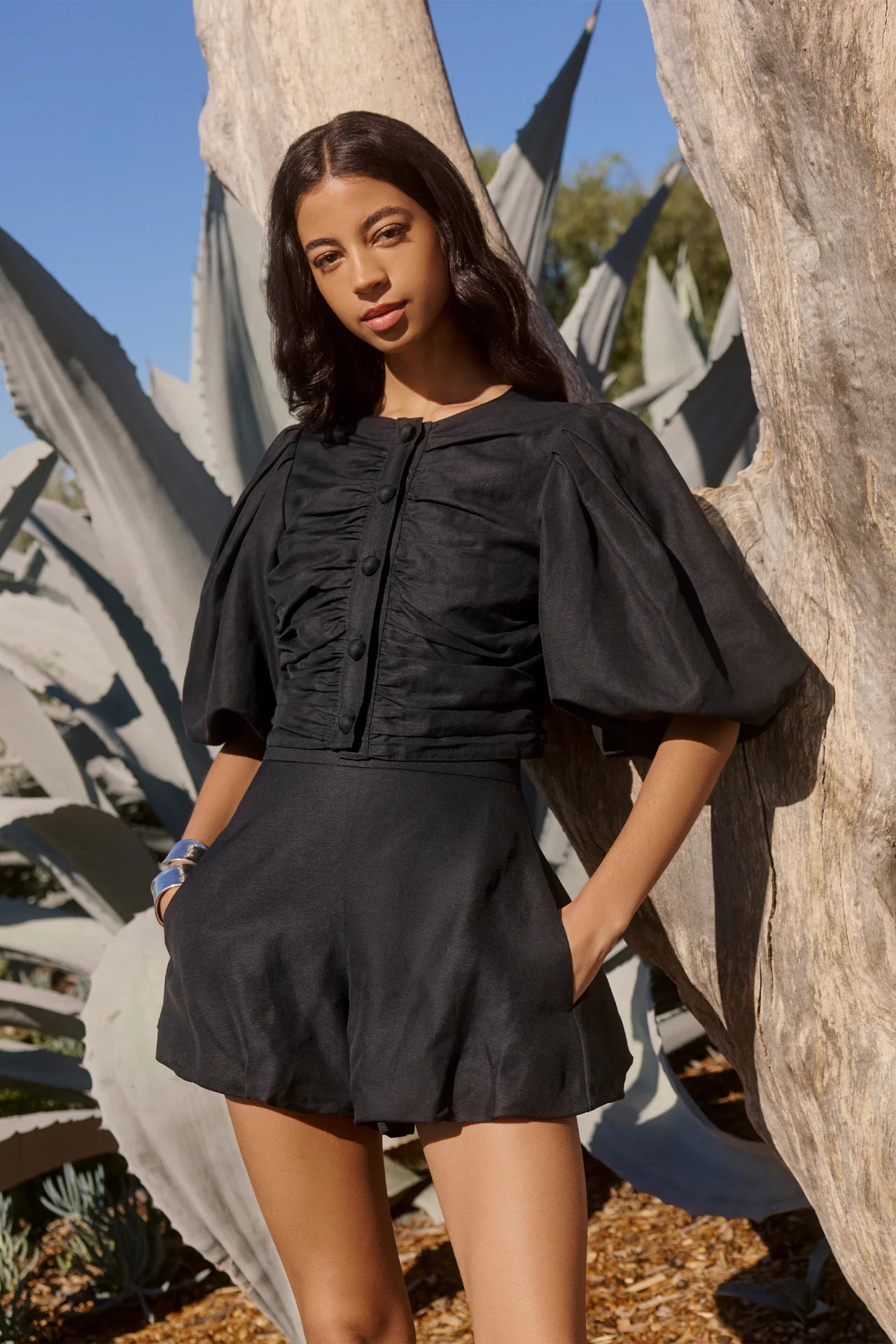 Black puff-sleeve ruched blouse with front buttons