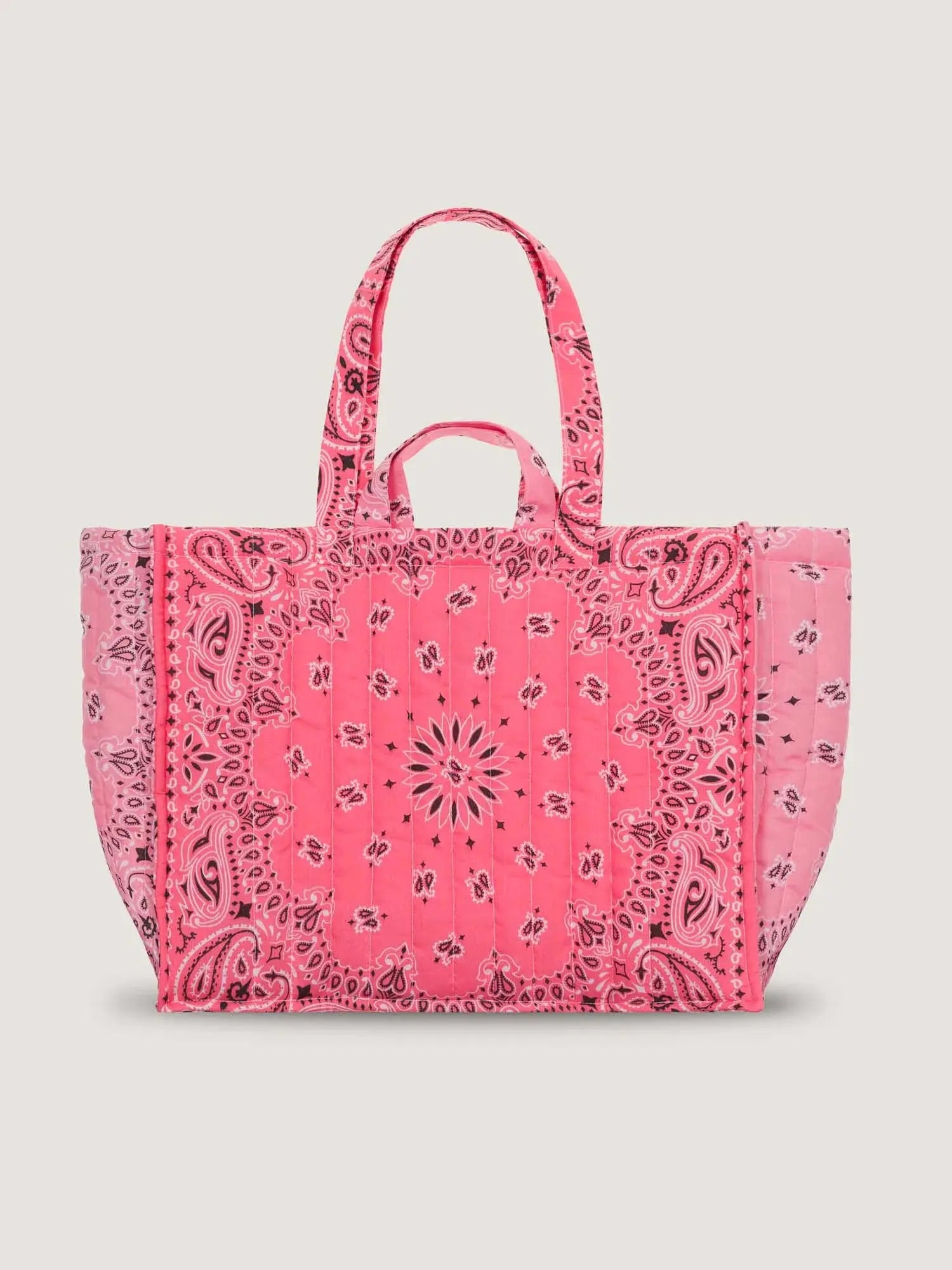 Pink canvas maxi tote bag with bandana-style print and sturdy top handles.