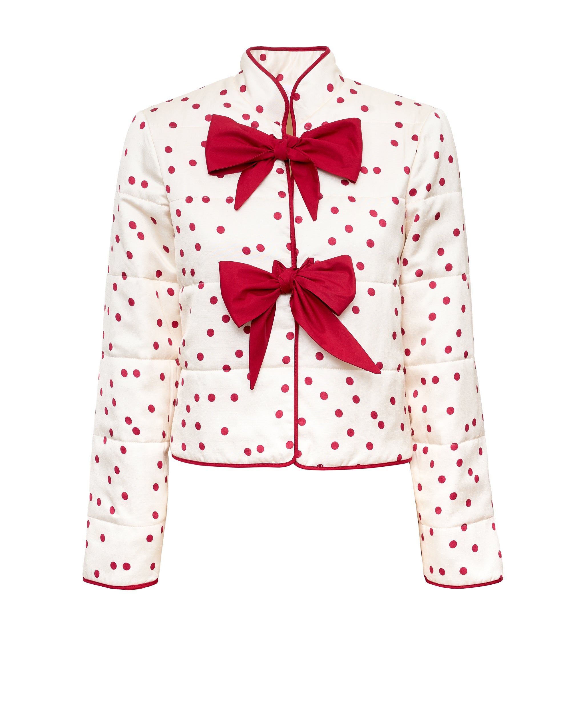 White short jacket with red polka dots, button front and large red bows at chest