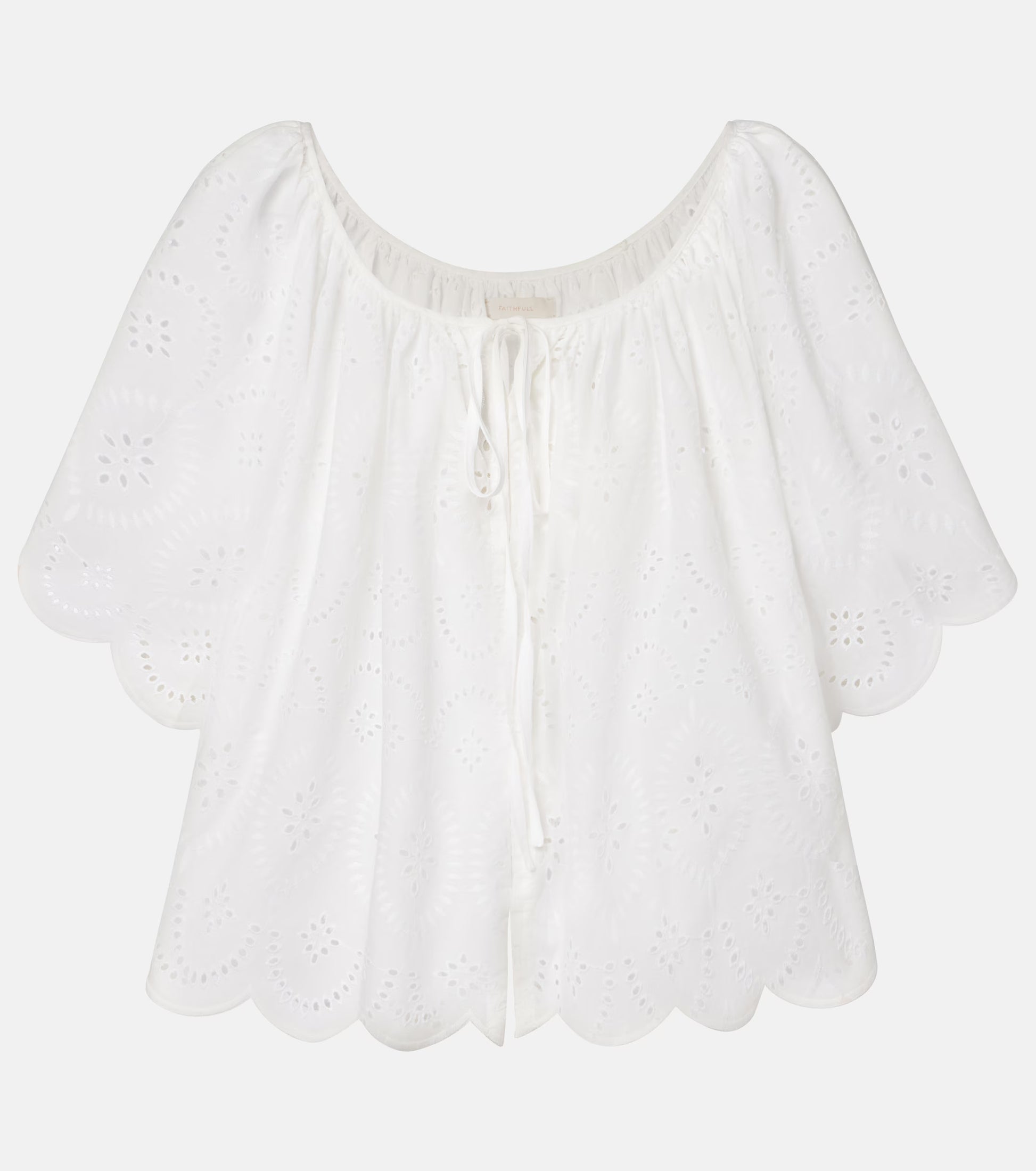 White eyelet off-shoulder top with scalloped hem and center drawstring tie