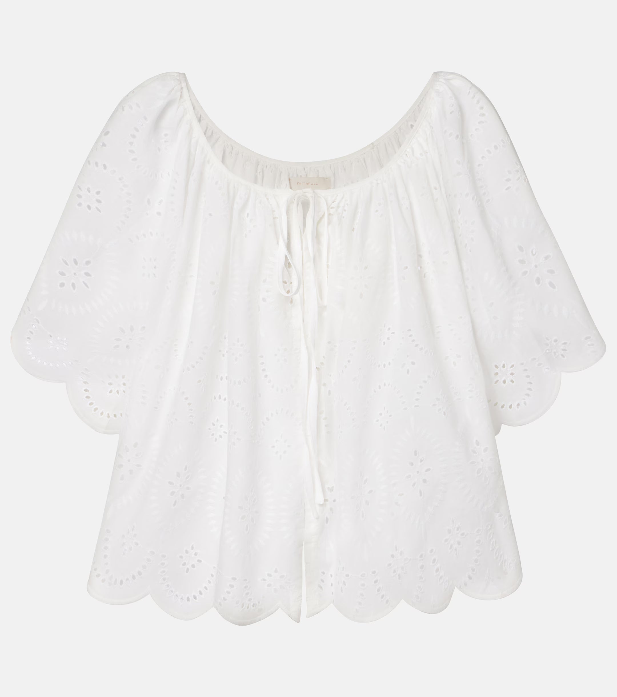 White eyelet off-shoulder top with scalloped hem and center drawstring tie
