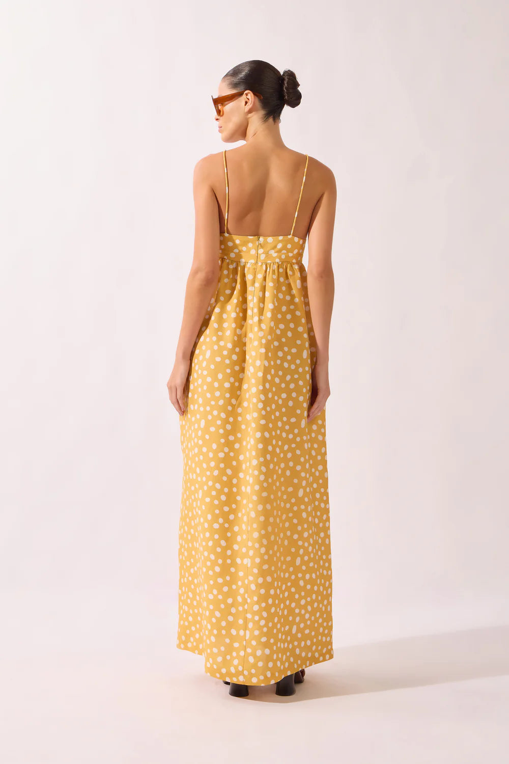 Back view polka dot maxi dress with spaghetti straps, yellow with white dots