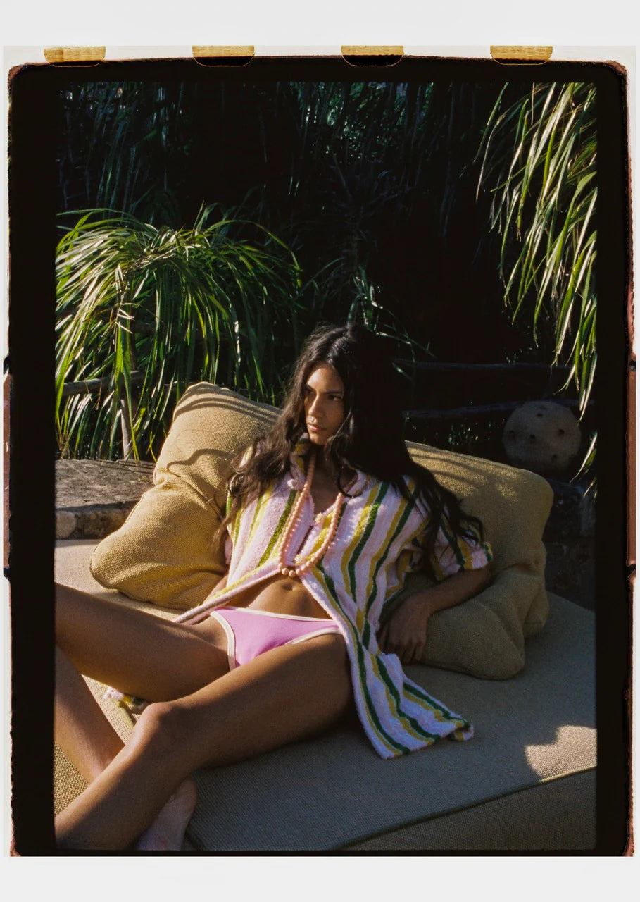 Multicolor striped cover-up shirt worn by person, collared and buttoned front
