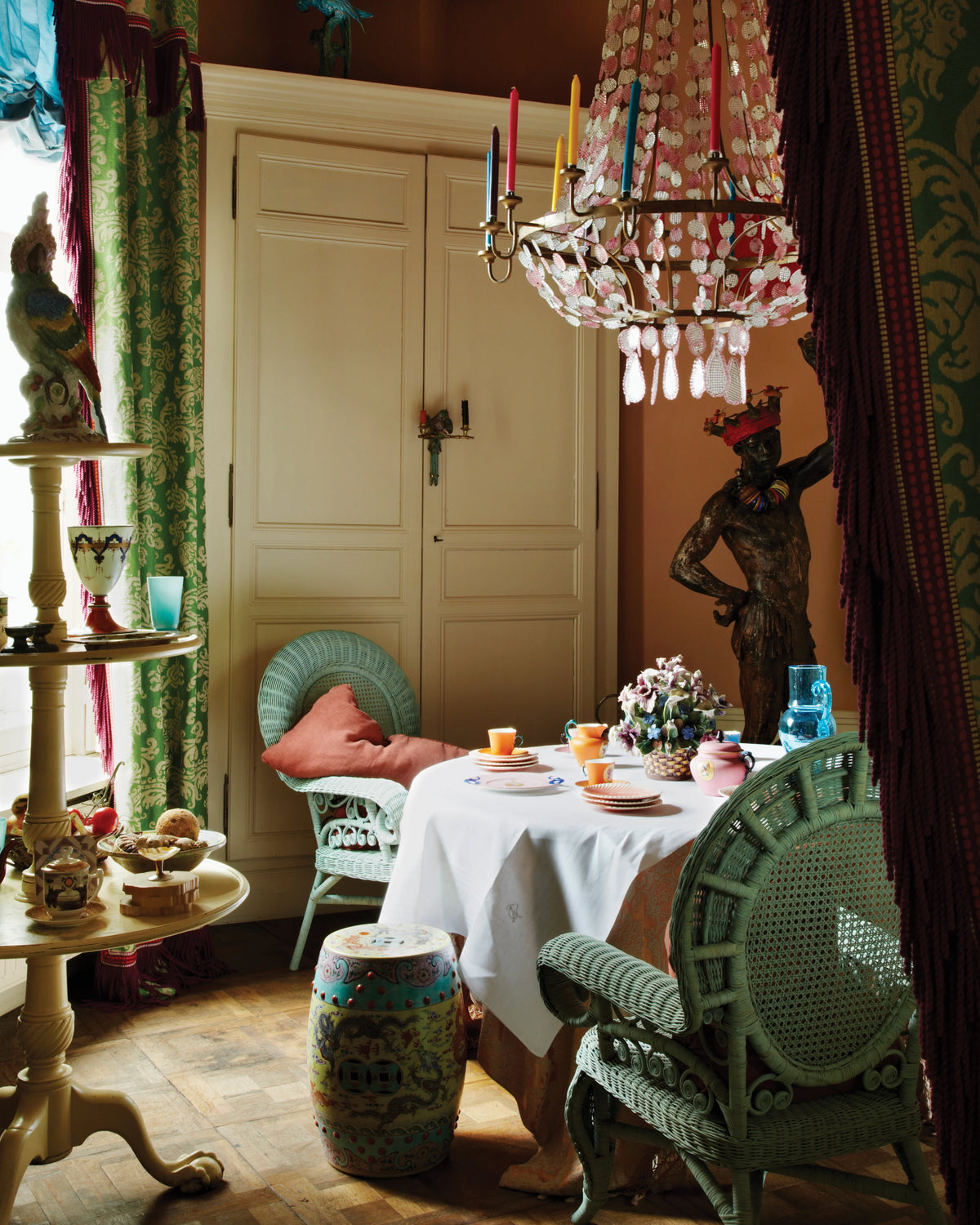 Rattan book page with small dining table and rattan chairs by a doorway