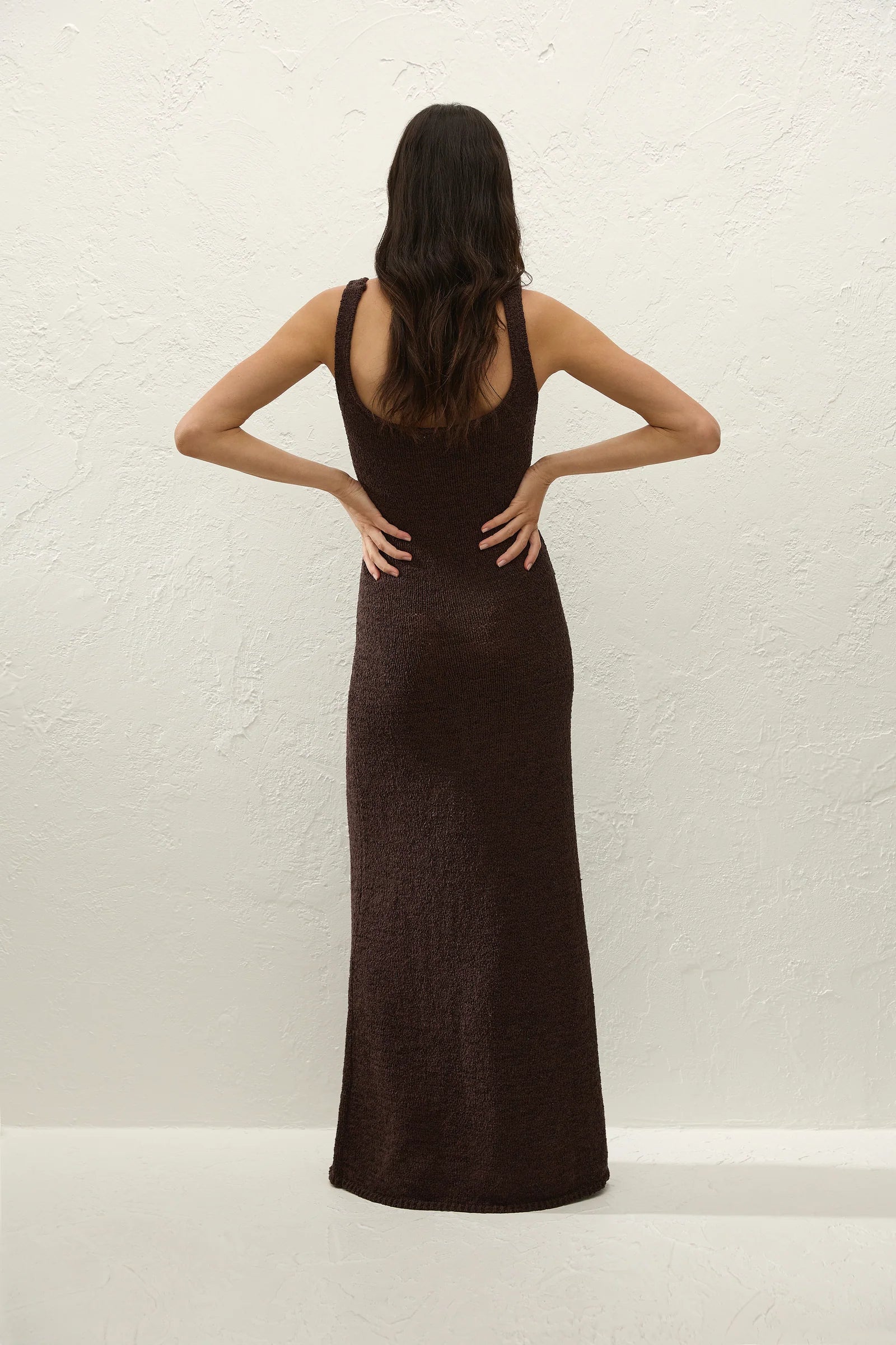Dark brown sleeveless maxi dress shown from back, scoop neckline