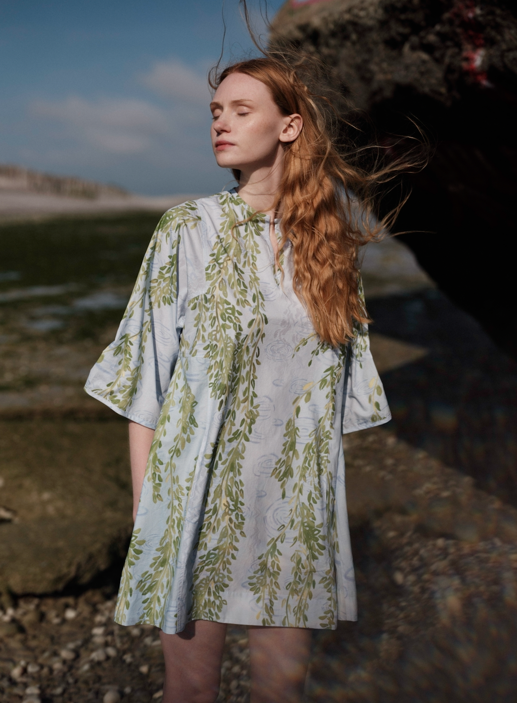 Short kaftan in light blue with green floral vine print, round neck and 3/4 sleeves.