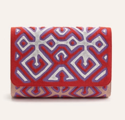 Oguala clutch with red and light pink geometric fabric and fold-over flap