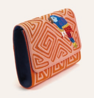 Guacamaya clutch with orange geometric flap and colorful parrot motif, side view