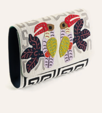 Cream clutch with colorful elephant graphic, open side showing dark lining
