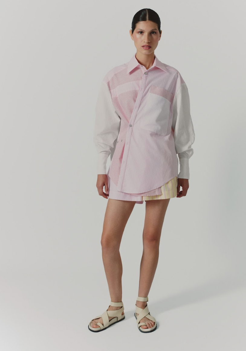 Pink striped button-up blouse with spread collar, chest pocket, and long sleeves