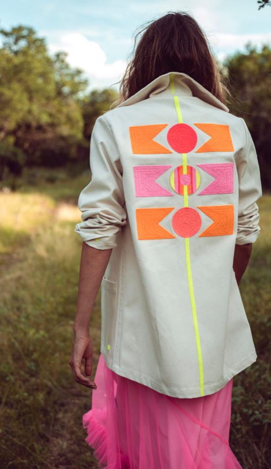 Light beige jacket with bold geometric back print and neon green vertical trim