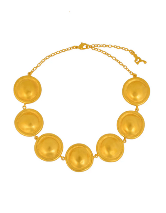 Gold necklace with round pendants on a white background
