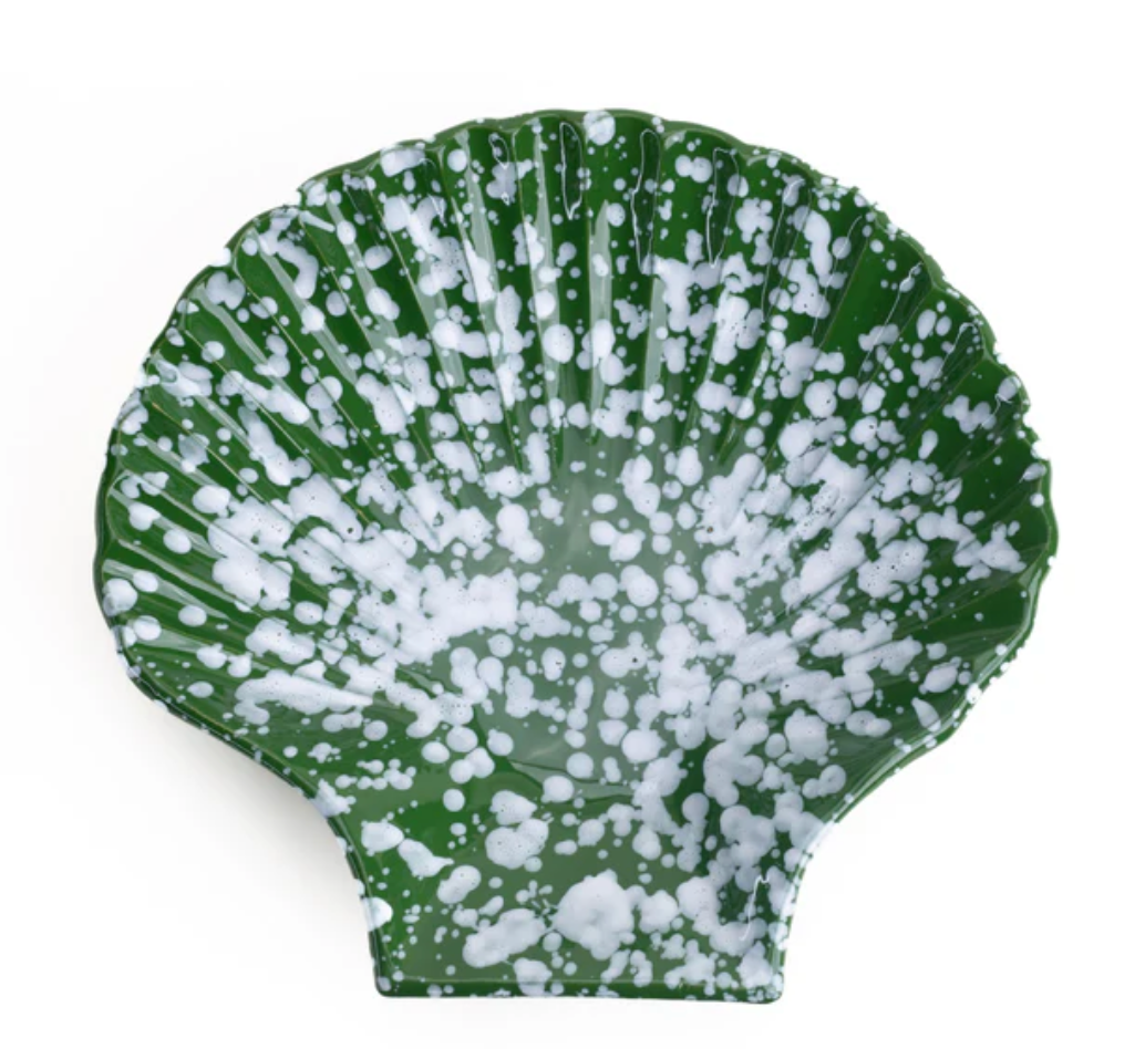 Green concha-shaped dish with white speckled pattern