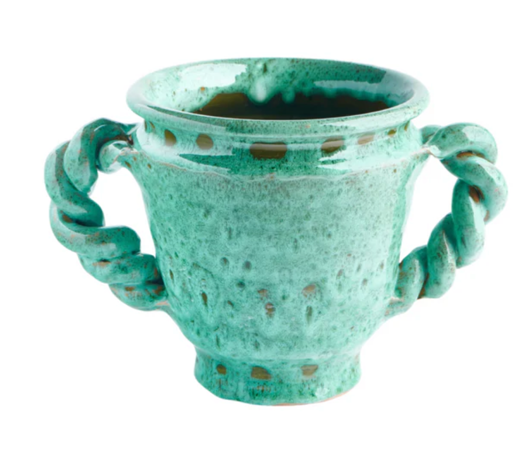 Ceramic cache pot in teal-green with perforated sides and curled loop handles.