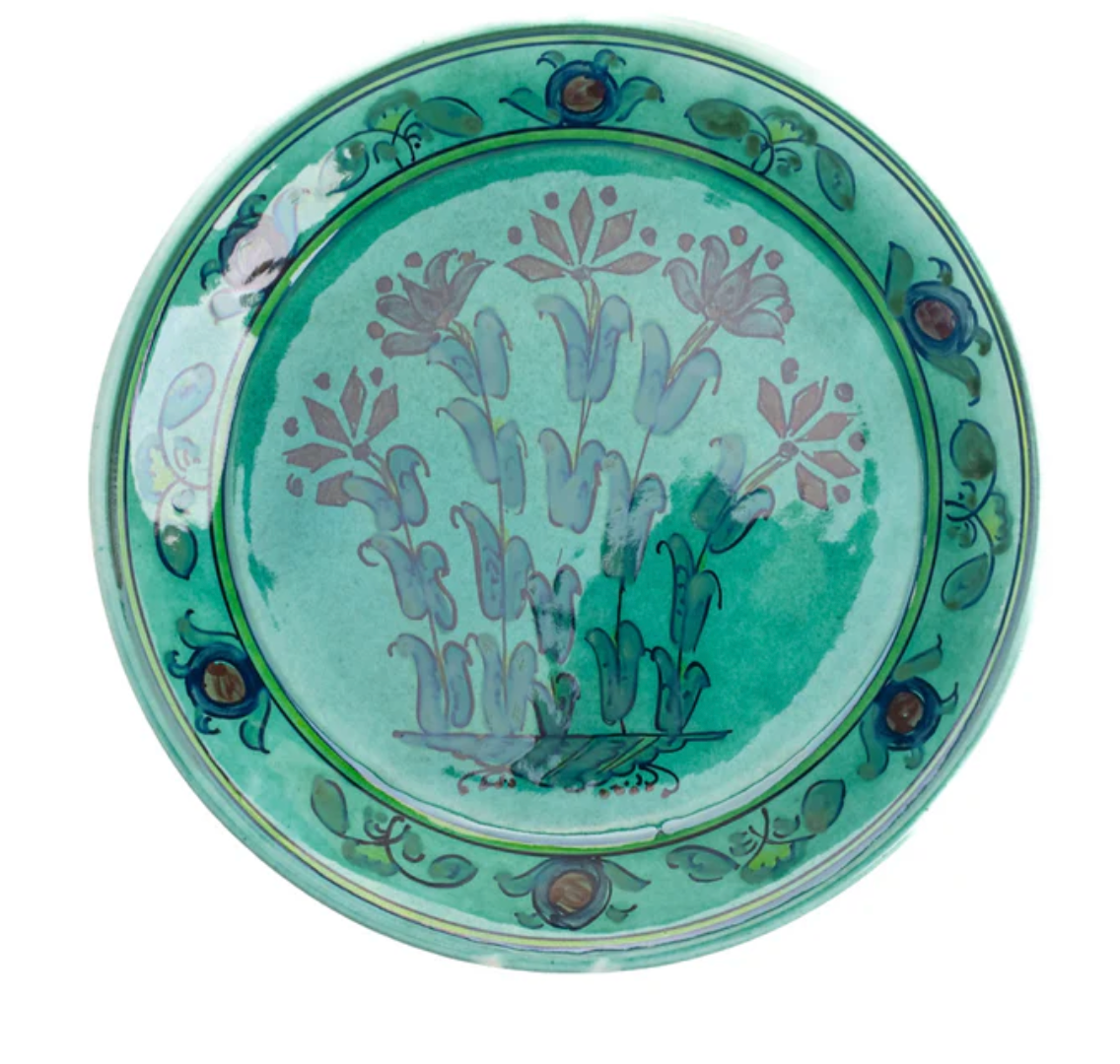 Round teal dessert plate with floral and vine pattern and decorative border