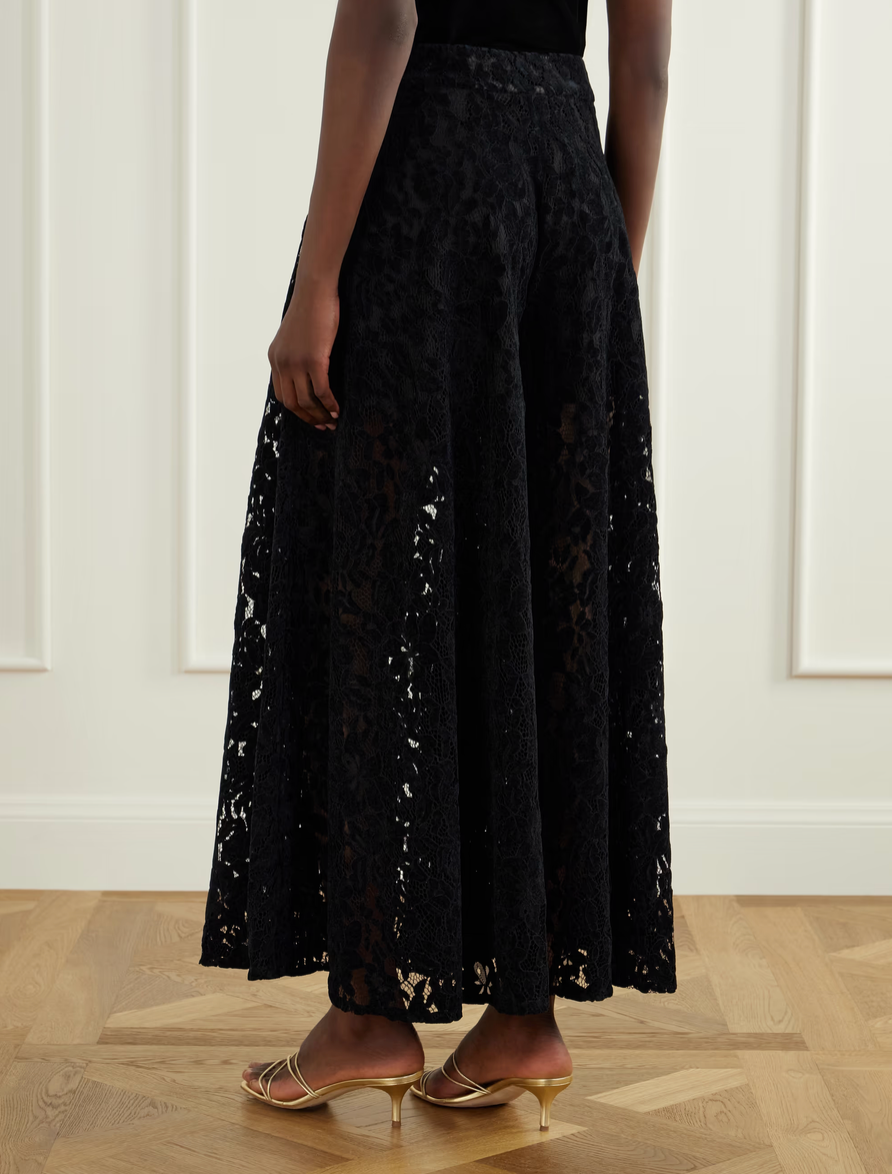 Black lace midi skirt with pleated, flowing A-line shape