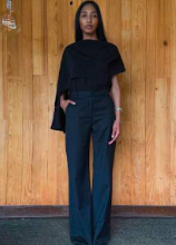 Black cape blouse with draped, cape-like shoulders and loose fit