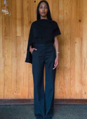 Dark cape blouse with draped sleeves and long straight silhouette