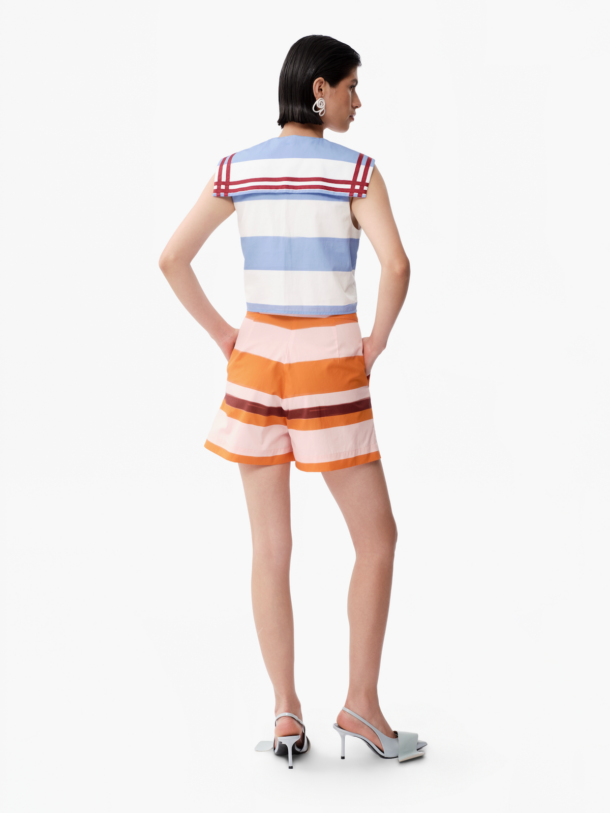 Back view of sleeveless striped top with blue-and-white bands and red shoulder yoke