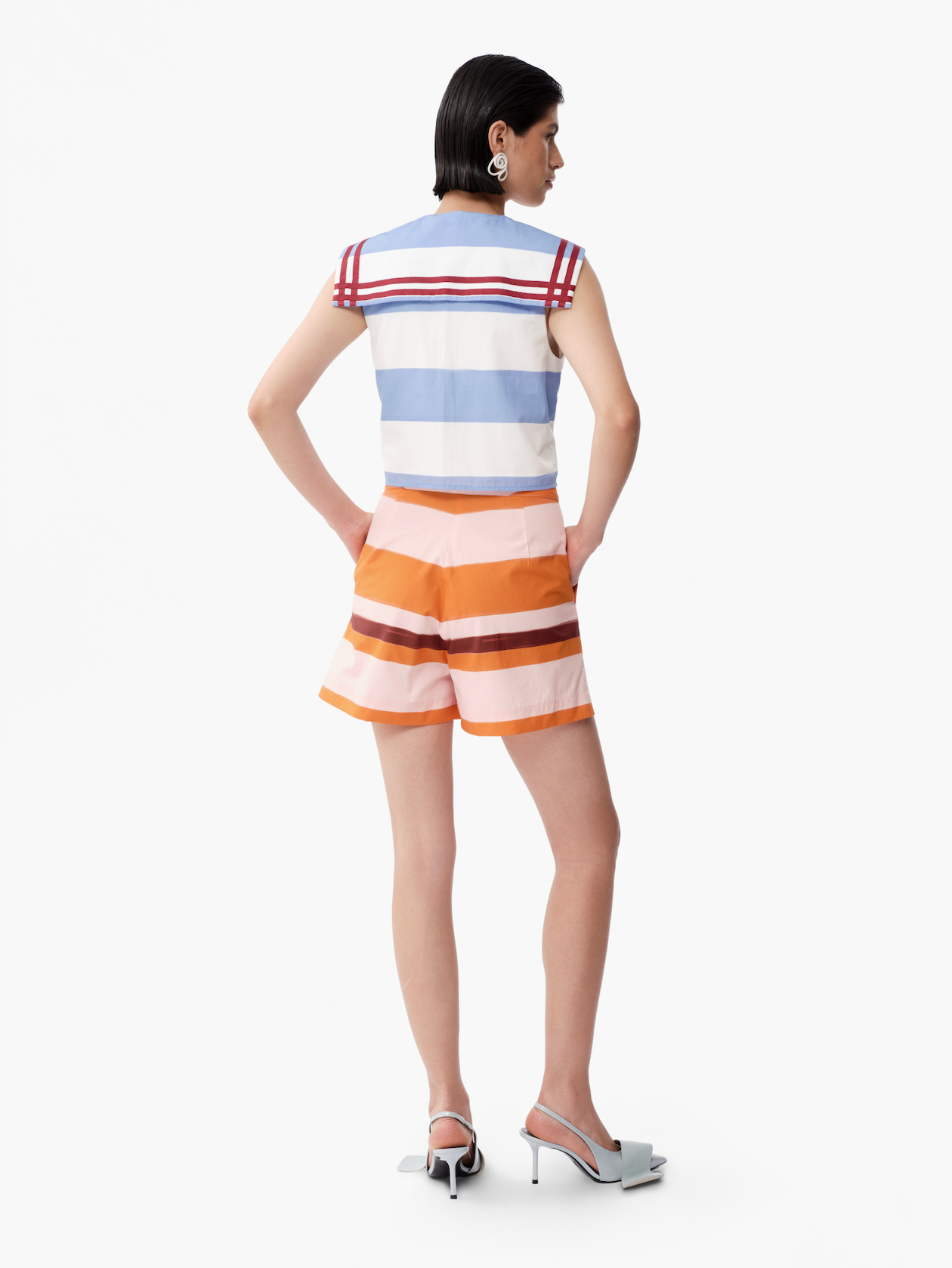Back view of sleeveless striped top with blue-and-white bands and red shoulder yoke