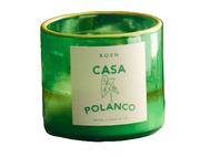 Green glass CASA POLANCO candle jar with cream label and leaf emblem on front