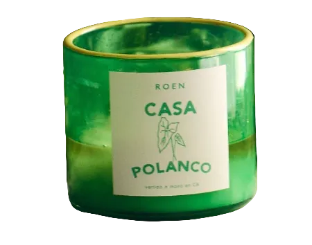 Green glass CASA POLANCO candle jar with cream label and leaf emblem on front