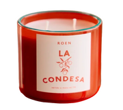 LA CONDESA scented candle in red glass jar, front label visible