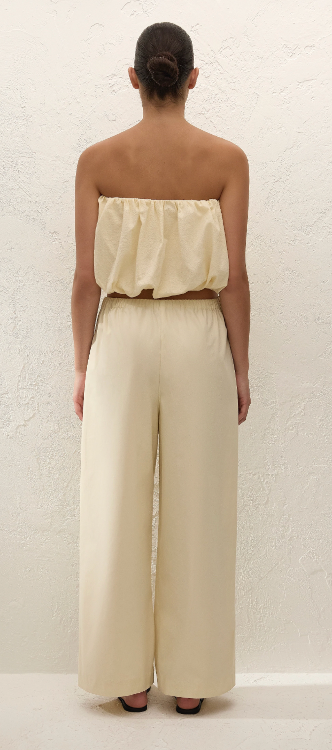 Cream fisherman-style trousers shown from back with wide cropped legs