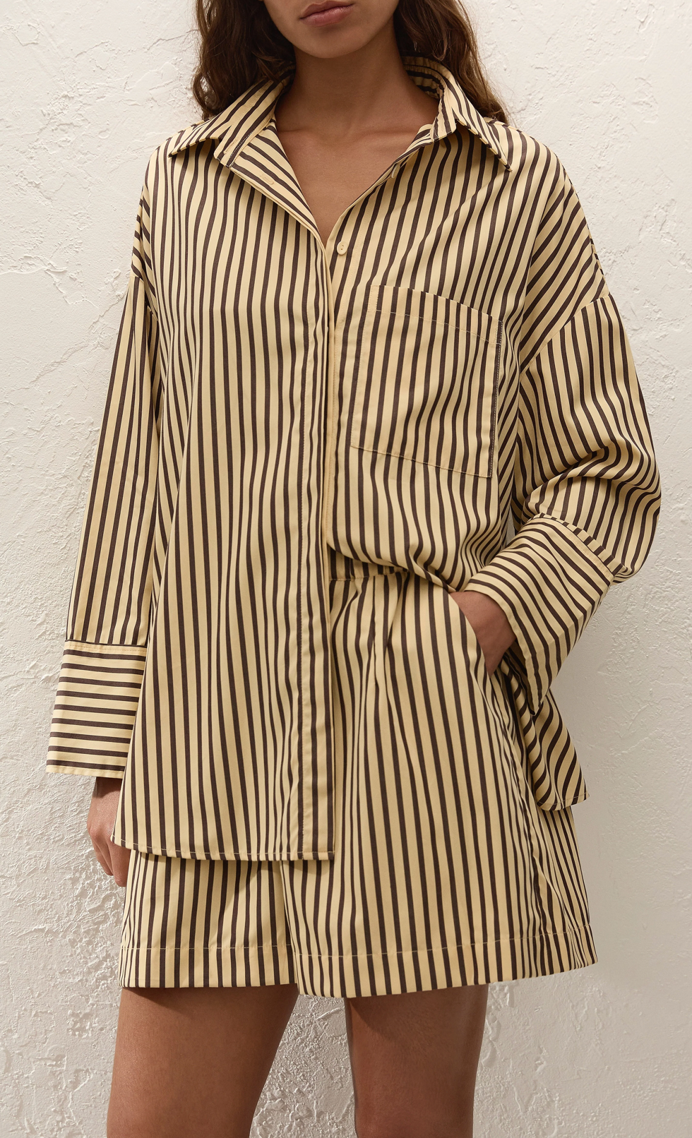Oversized striped button-up shirt with pointed collar and chest pocket