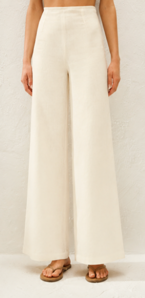 Off-white wide-leg pants with front crease and flowy relaxed silhouette