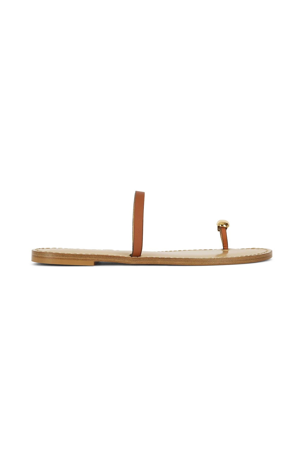 Tan leather sandal side view with gold-tone buckle strap and flat sole