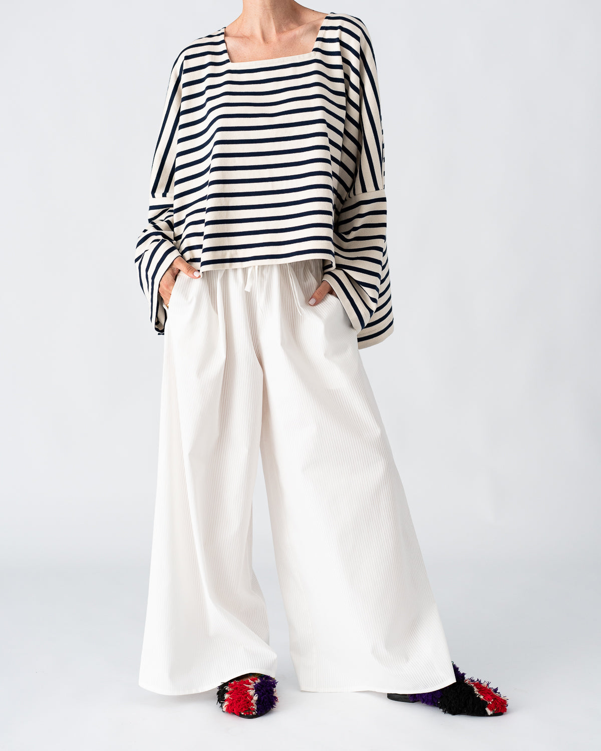 Oversized mariniere top on model, cream and navy horizontal stripes, wide neckline