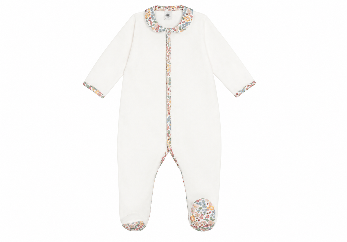 White snap-front baby onesie with floral Peter Pan collar and floral cuffs