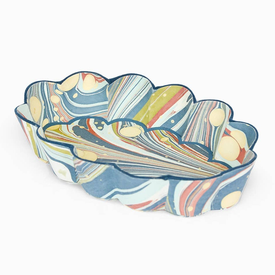 Scalloped desk tray with blue, white, and multicolor abstract marbled pattern