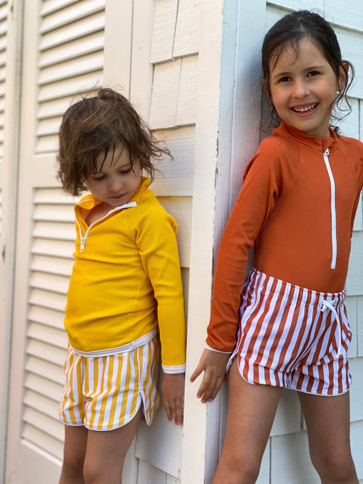 Yellow-and-white striped short shorts with elastic drawstring waist and side pocket
