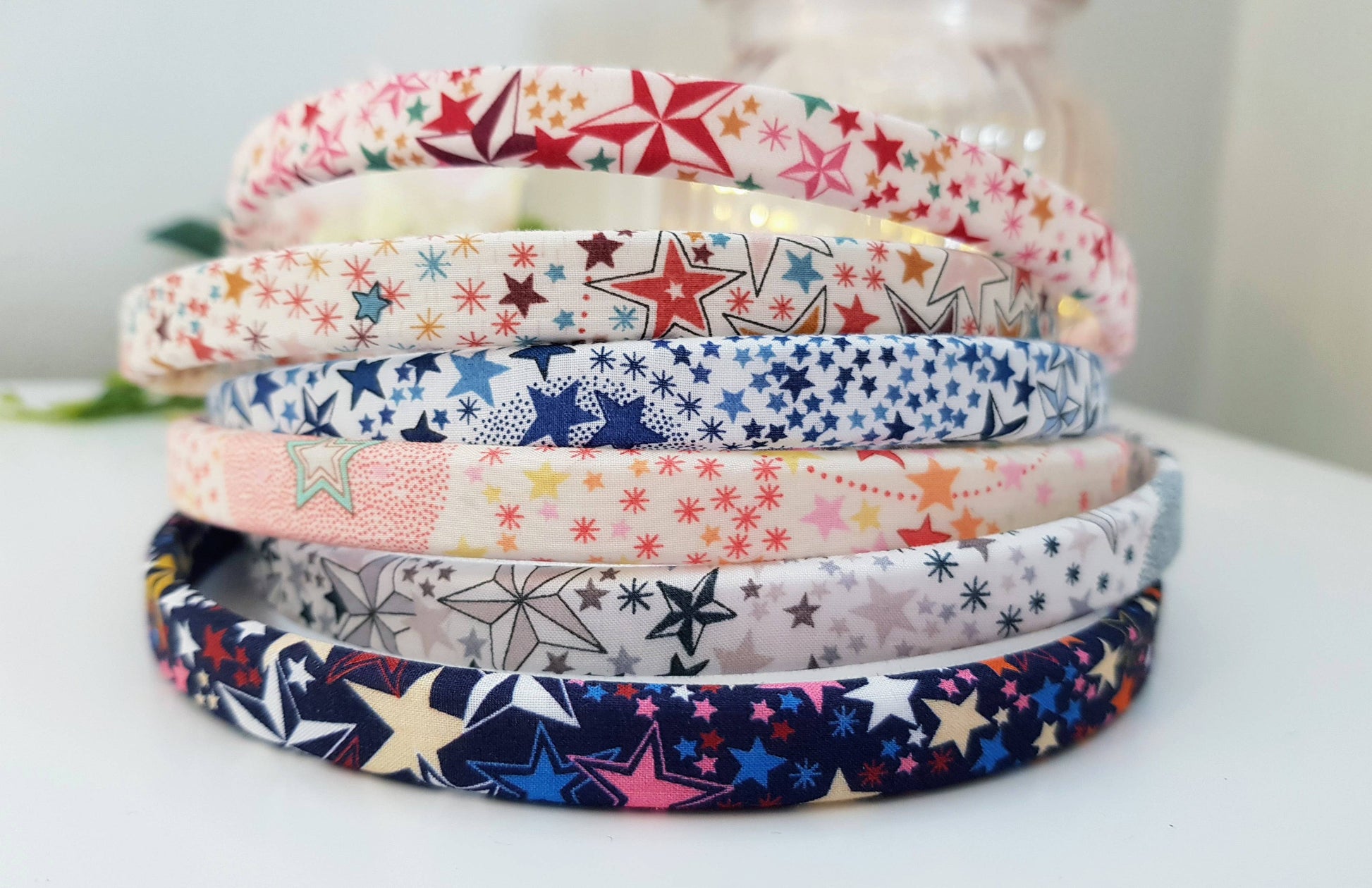 Stack of star-pattern headbands in red, blue, pink, and white