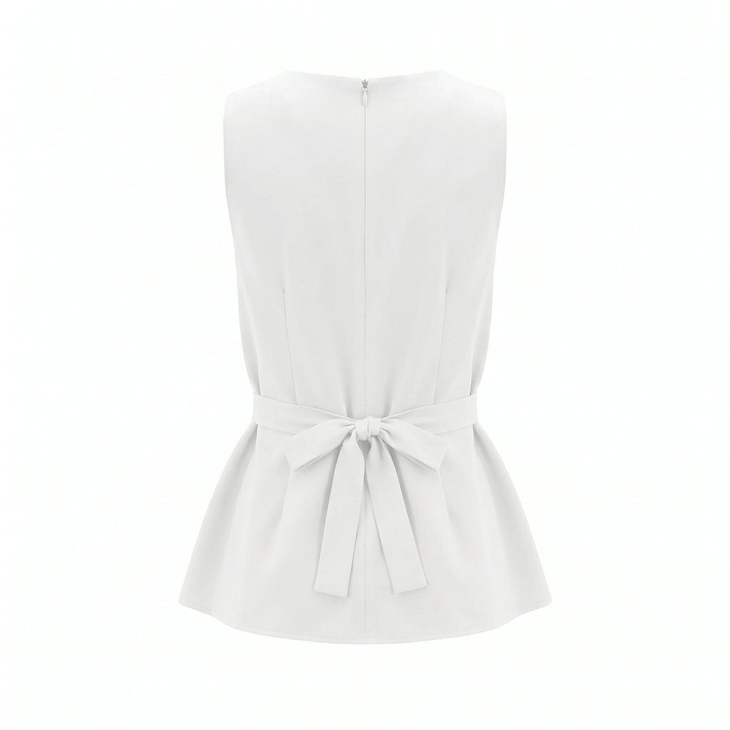 White sleeveless top back with button closure and bow at waist