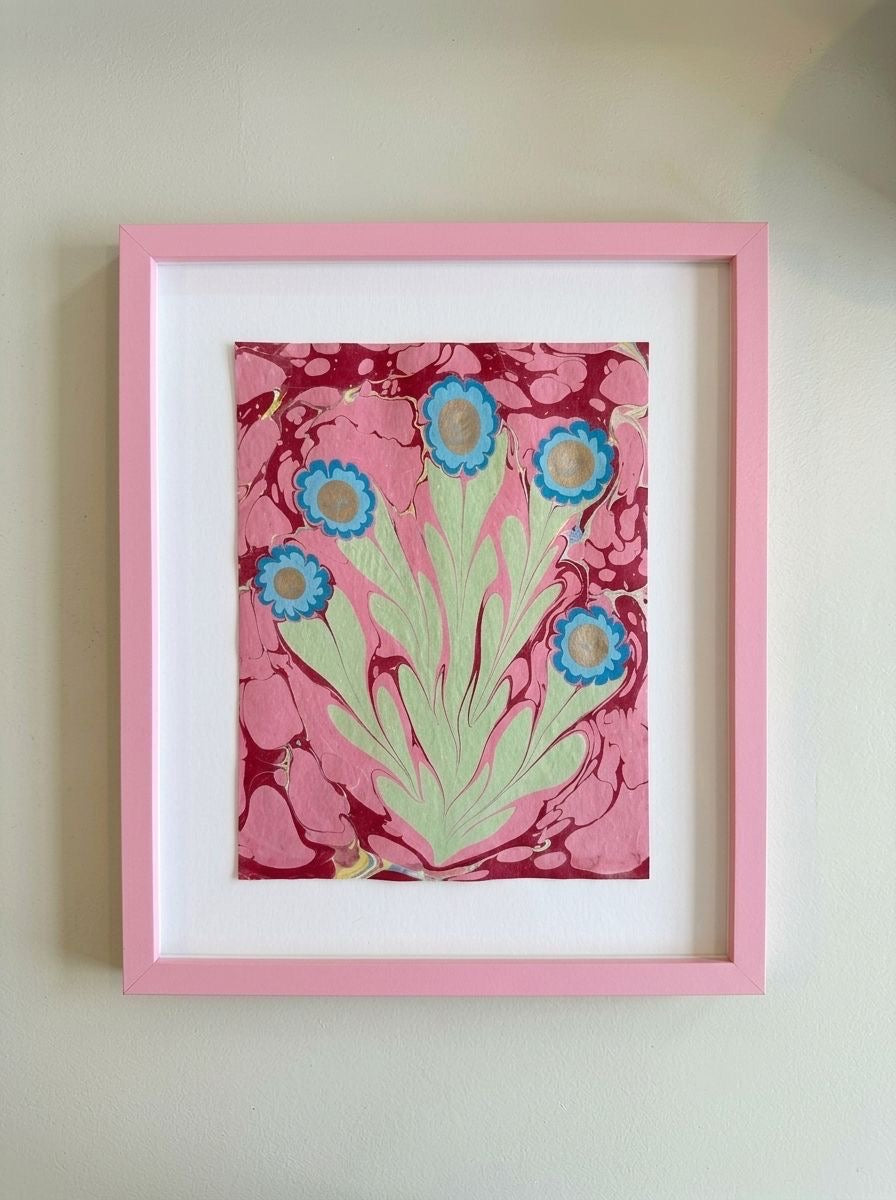 Framed flower painting with pink and maroon abstract background, teal blooms, green stems