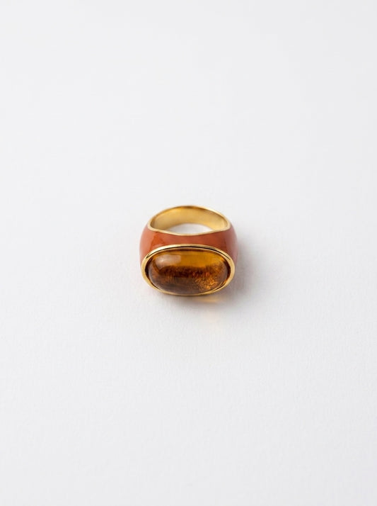 Amber resin inset candy ring with gold-tone band and reddish outer shell