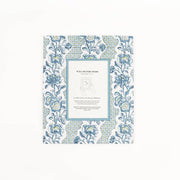 Blue block-printed wall picture frame with floral trellis pattern and white photo mat