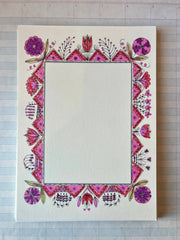 Decorative folk picture frame with pink/purple floral border and diamond corner accents