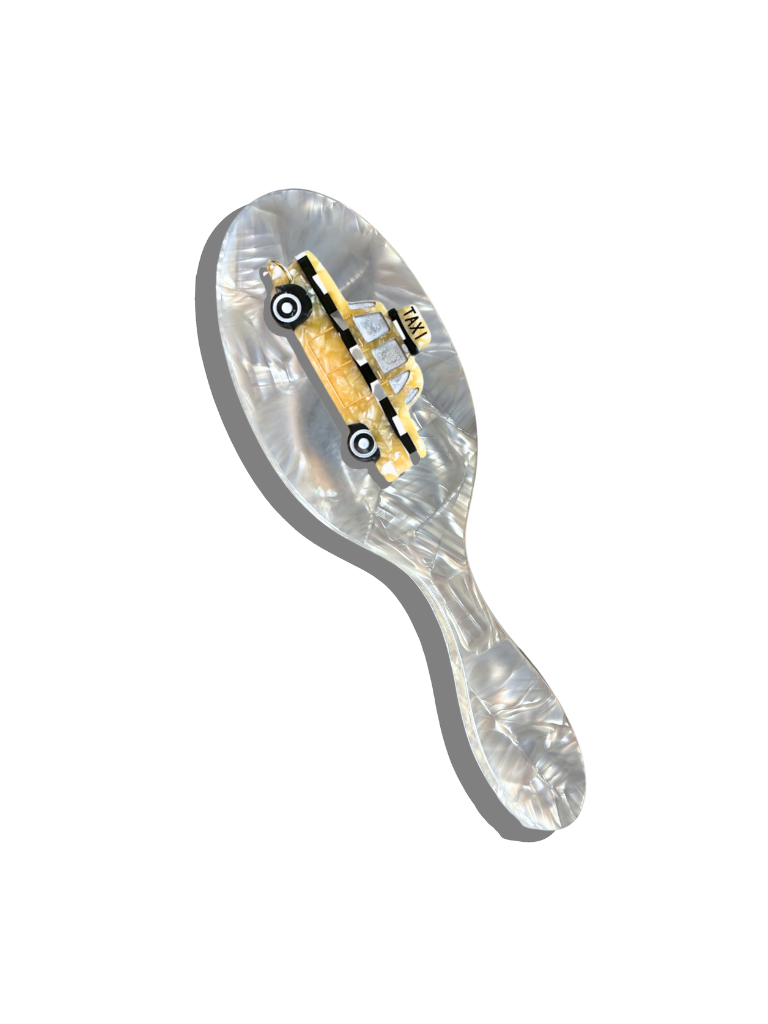 Hair brush with hand-painted taxi motif on clear acetate handle