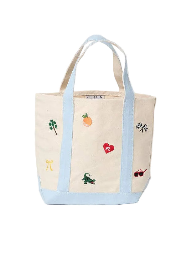 Small canvas tote bag with light blue handles and colorful Florida icon patch design