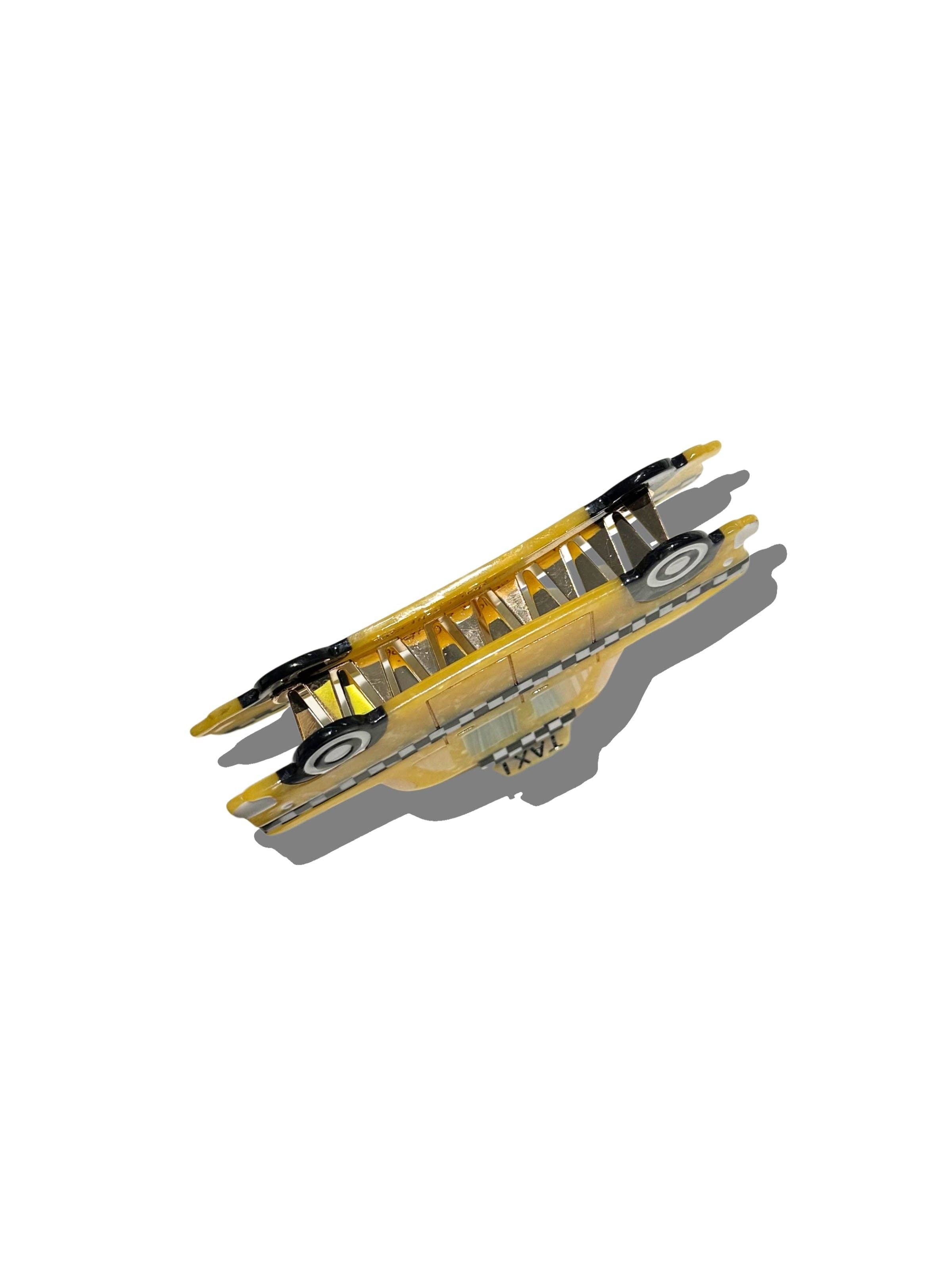 Yellow taxi cab claw hair clip with checkered trim and white wheel details