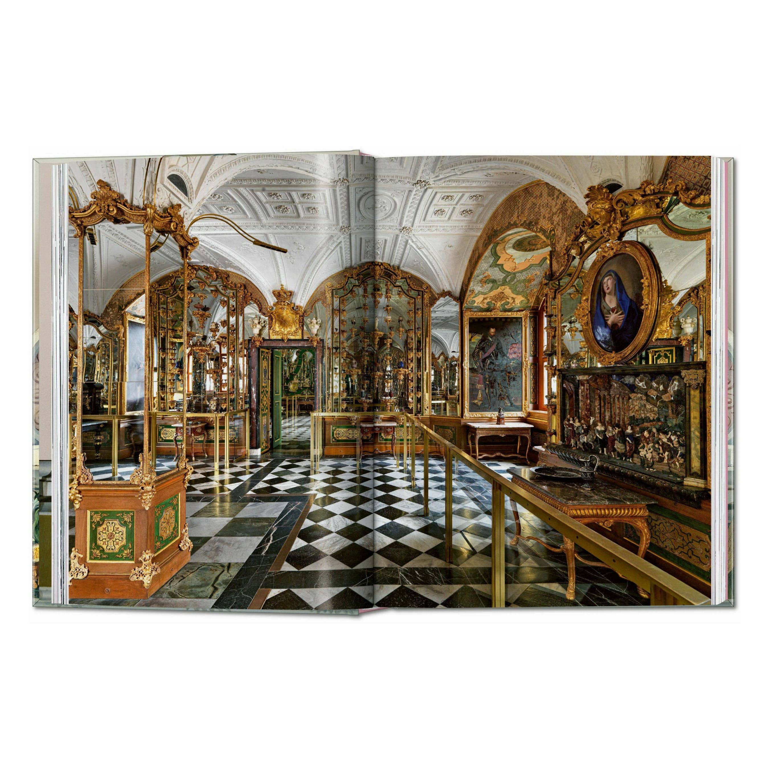Cabinet of Curiosities book spread showing an ornate room with display cases and benches