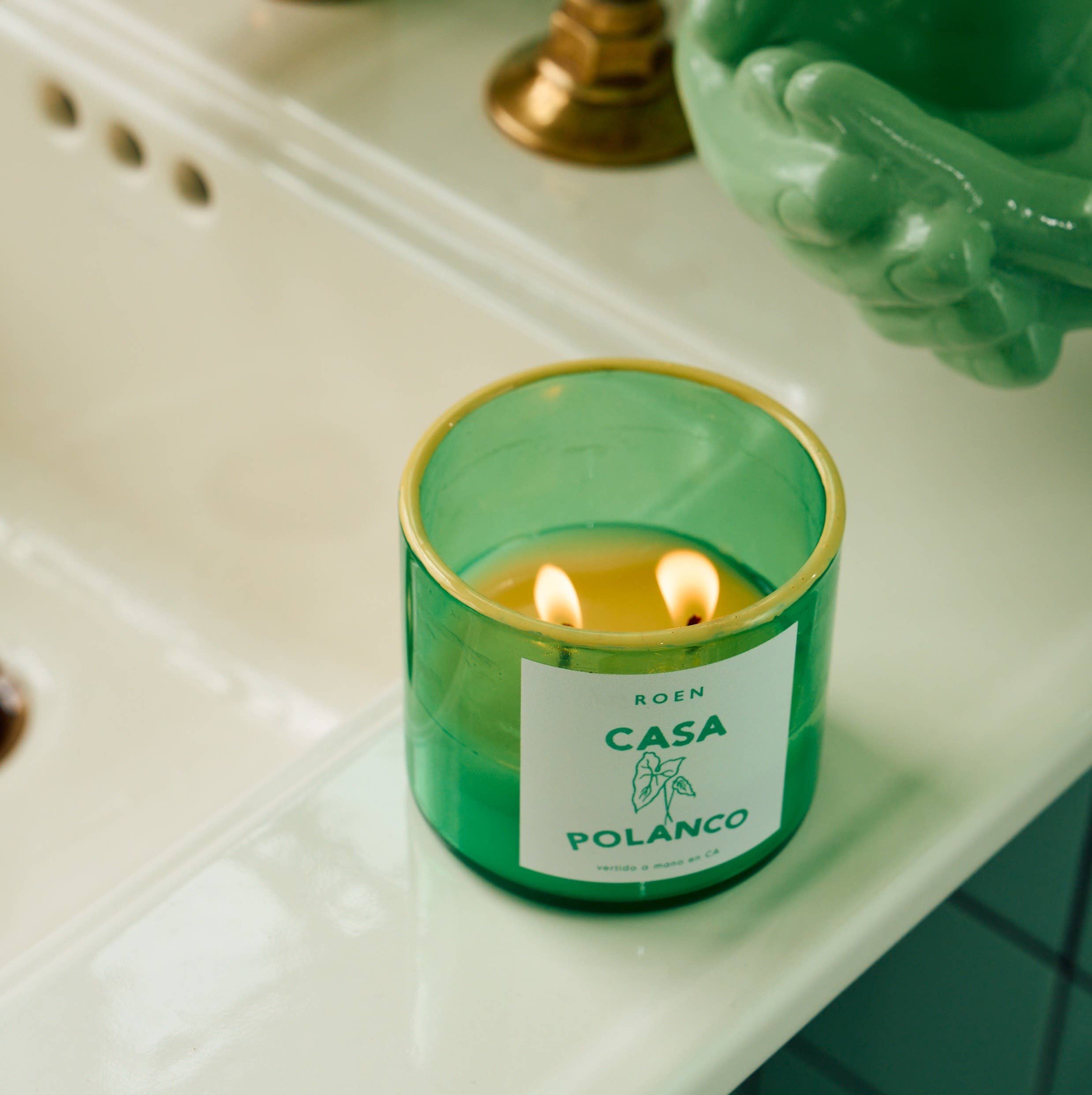 Green glass candle jar with flame, CASA POLANCO label