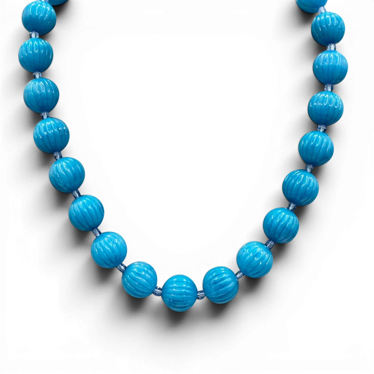 Turquoise carved melon bead necklace with round ribbed beads, full strand view