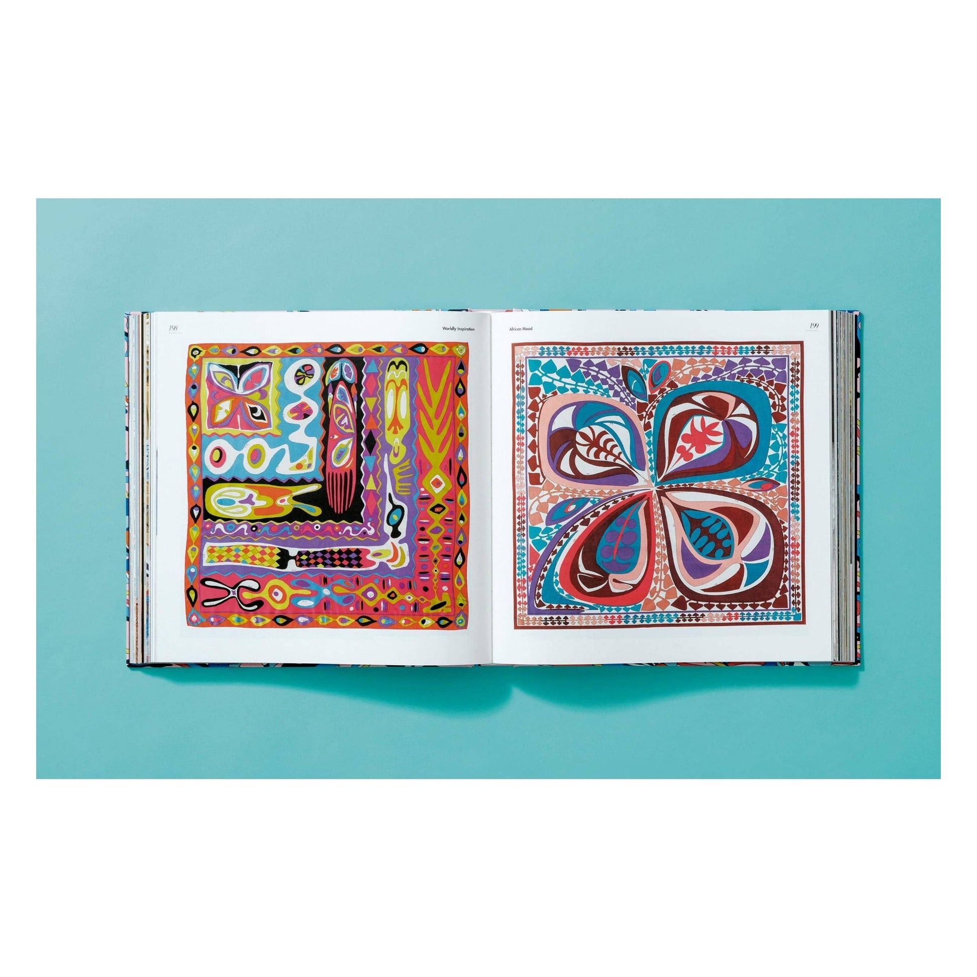 Pucci updated edition book, open spread with colorful abstract artwork prints