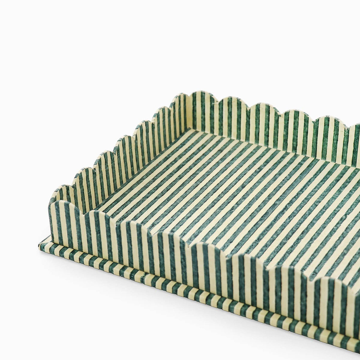 Large scalloped serving tray close-up, striped green and white with scalloped rim.