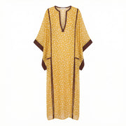 Yellow polka dot maxi kaftan, V-neck, dark trim, wide sleeves, side slits